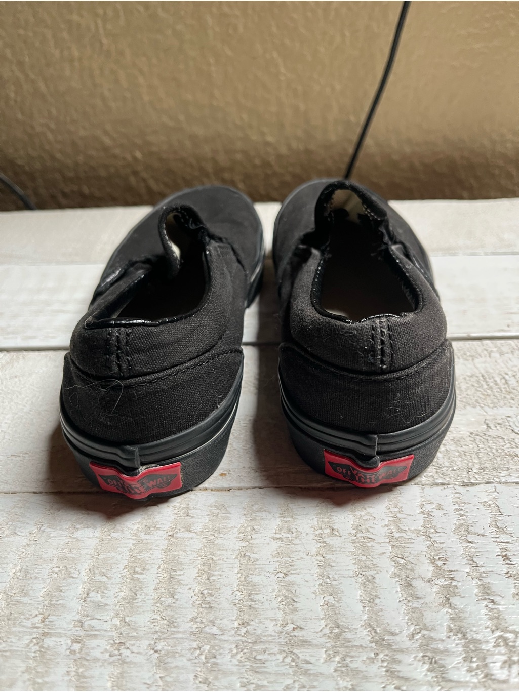 Vans Kids Black Slip-On Sneakers With Red Heel Logos